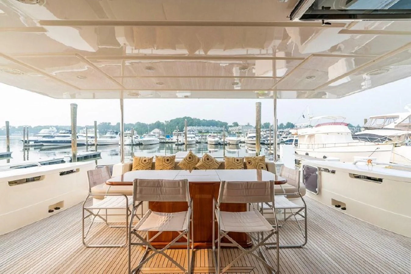 a room with tables and chairs aboard FERRETTI Yacht for Sale