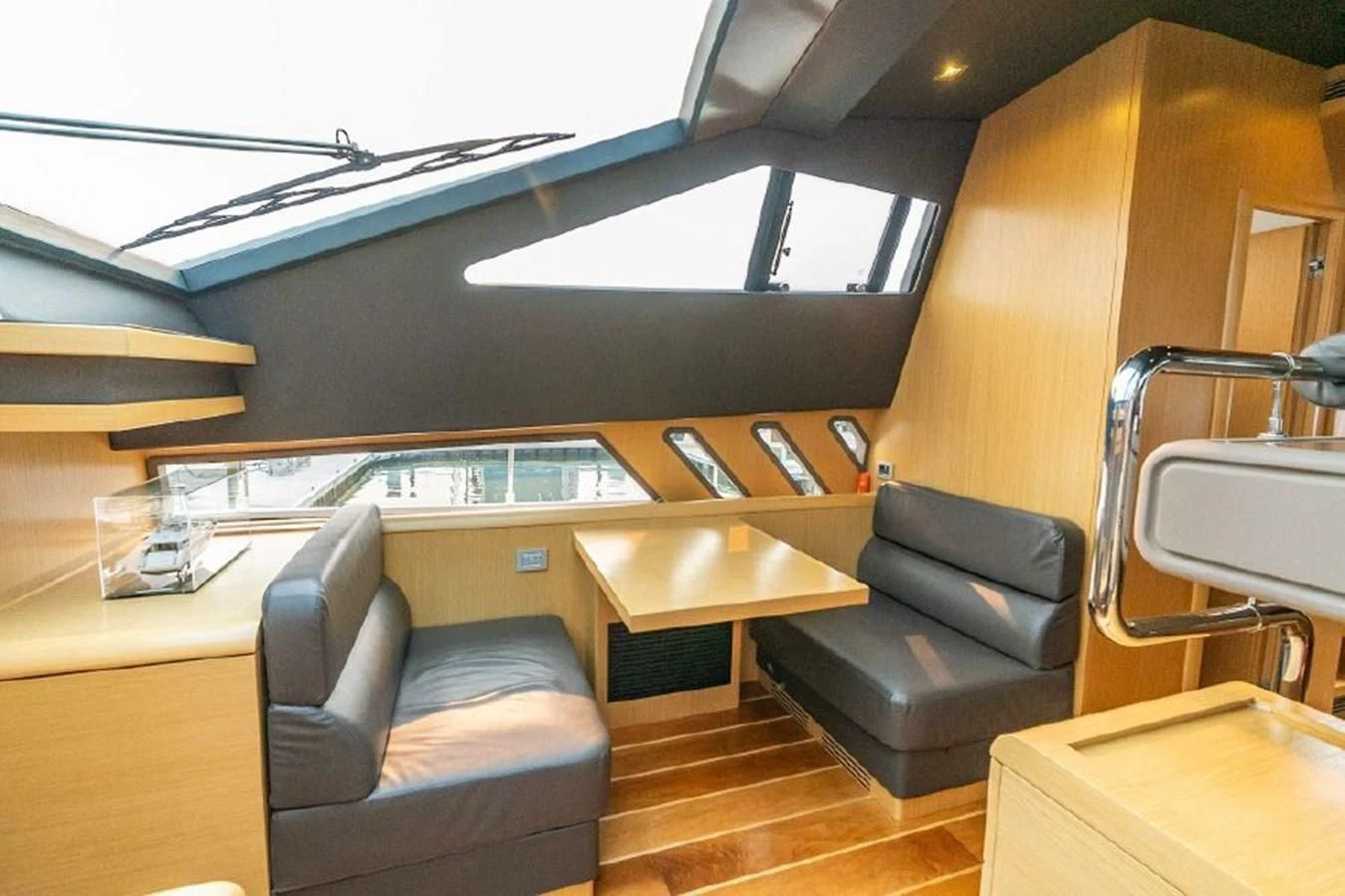 a room with a couch and a table and chairs aboard FERRETTI Yacht for Sale