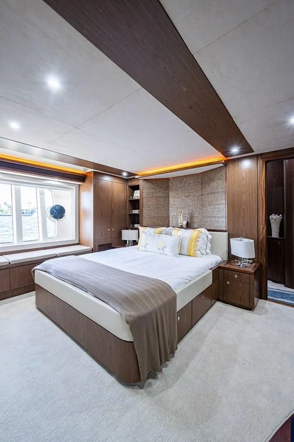 a large bedroom with a large bed aboard FERRETTI Yacht for Sale