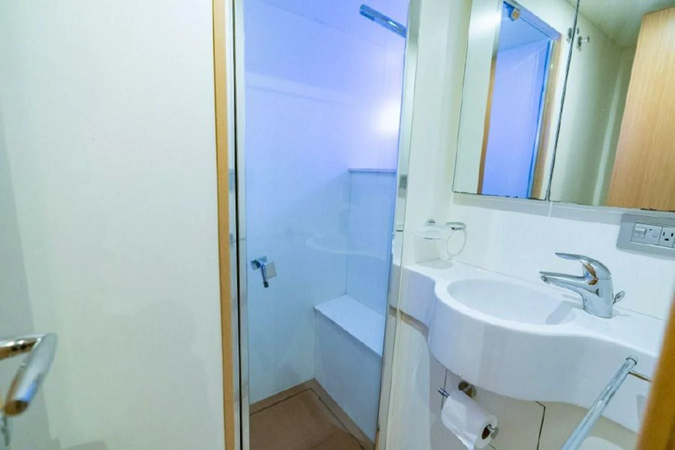 a bathroom with a sink and a mirror aboard FERRETTI Yacht for Sale