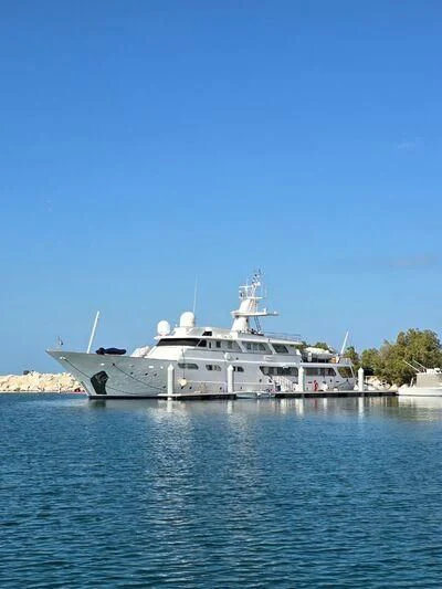 a large white ship in the water aboard UM HURAIR Yacht for Sale