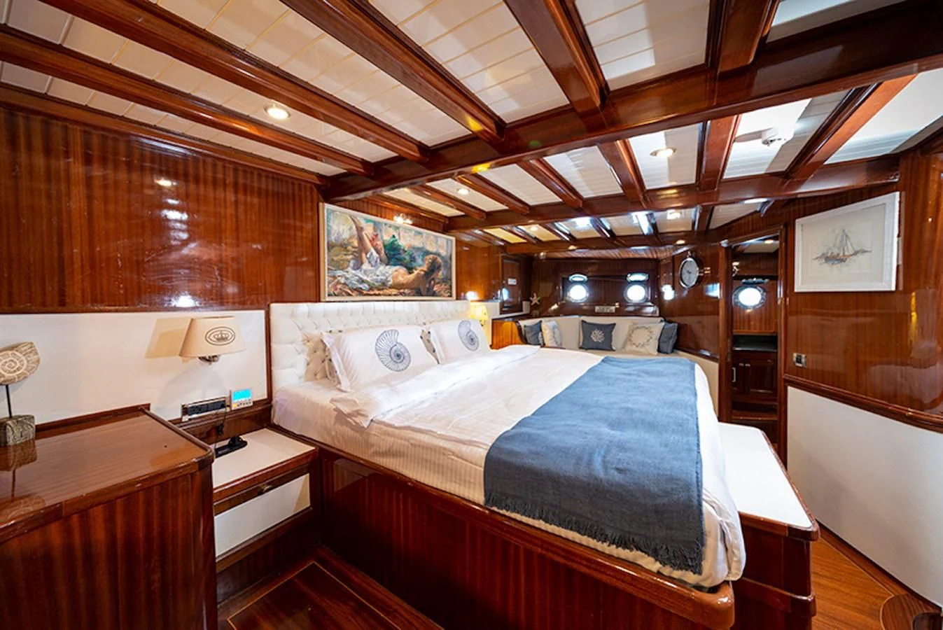 a room with a bed and a desk aboard QUEEN OF DATCA Yacht for Charter