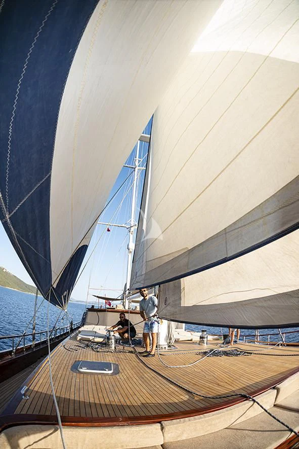 a person standing on a deck aboard QUEEN OF DATCA Yacht for Charter