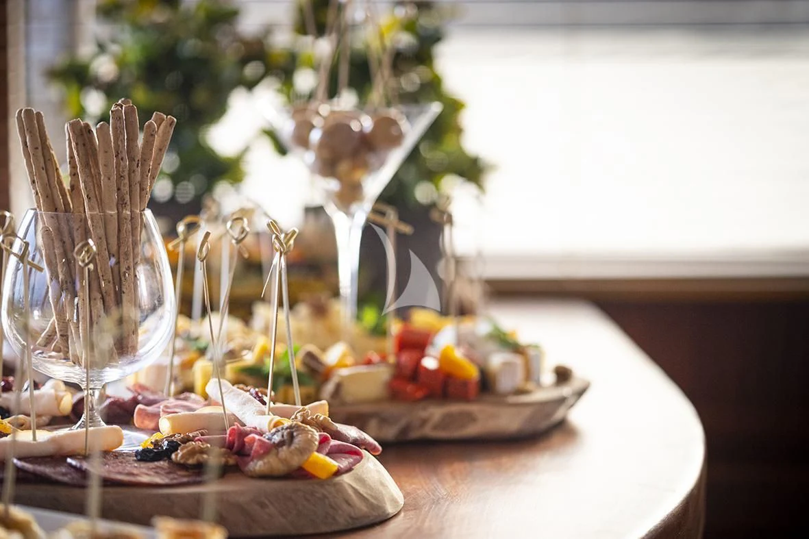 a table with food and glasses aboard QUEEN OF DATCA Yacht for Charter