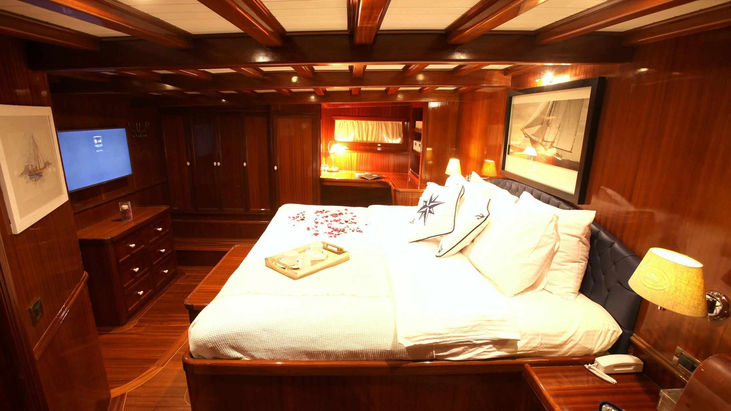 a hotel room with a large bed aboard QUEEN OF DATCA Yacht for Charter