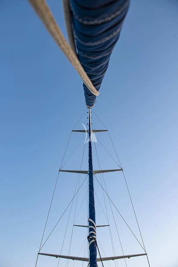 a person holding a pole aboard QUEEN OF DATCA Yacht for Charter