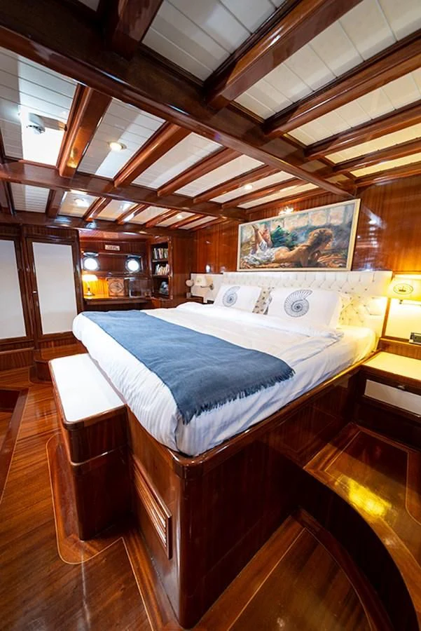 a bed in a room aboard QUEEN OF DATCA Yacht for Charter