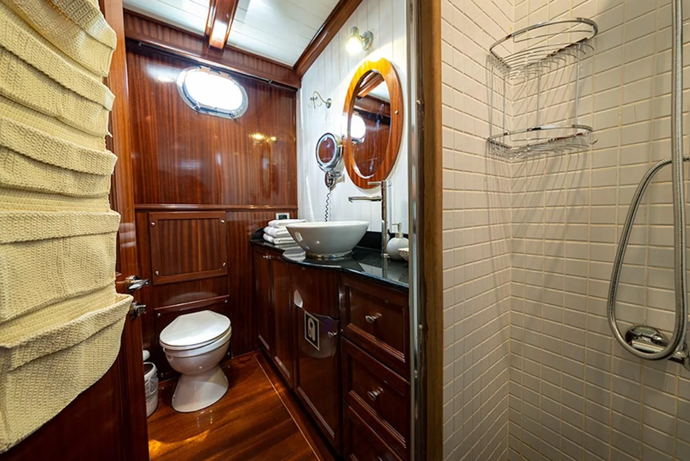 a bathroom with a sink toilet and a mirror aboard QUEEN OF DATCA Yacht for Charter