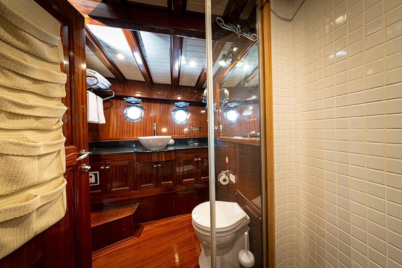 a bathroom with a glass shower aboard QUEEN OF DATCA Yacht for Charter