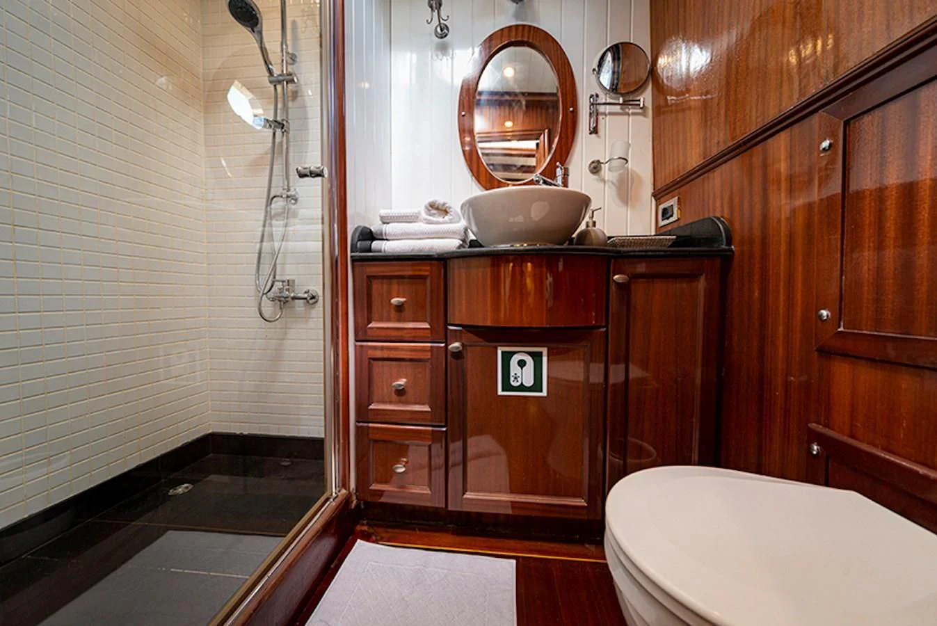 a bathroom with a sink and toilet aboard QUEEN OF DATCA Yacht for Charter