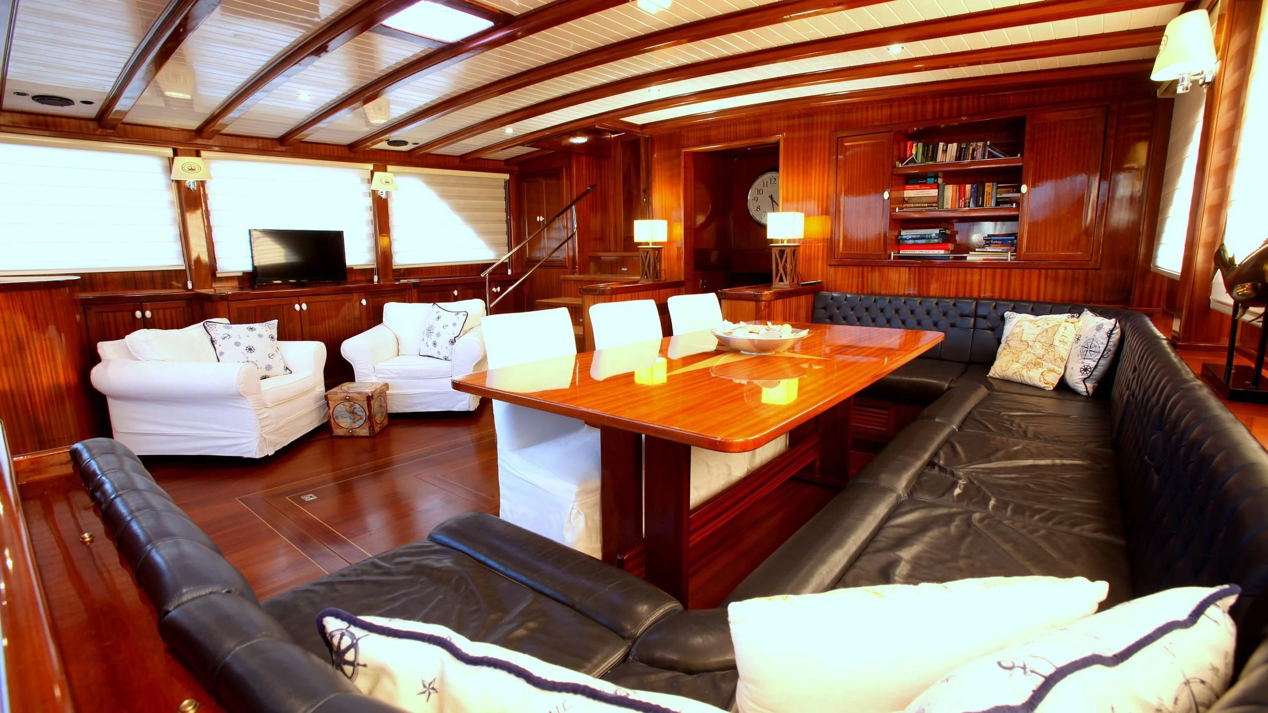 a living room with a couch and a table aboard QUEEN OF DATCA Yacht for Charter