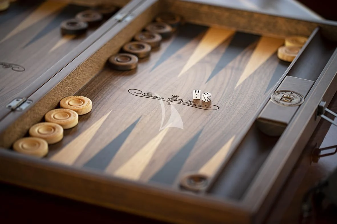 a wooden board with coins aboard QUEEN OF DATCA Yacht for Charter