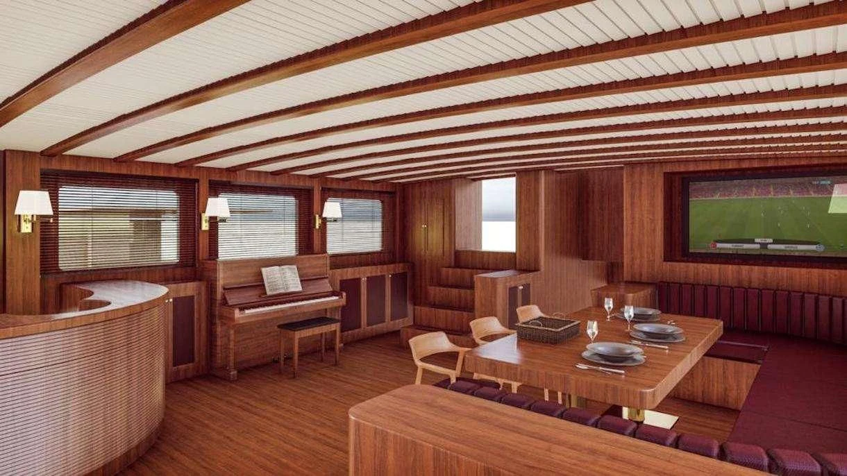 a room with a table and chairs aboard QUEEN OF DATCA Yacht for Charter