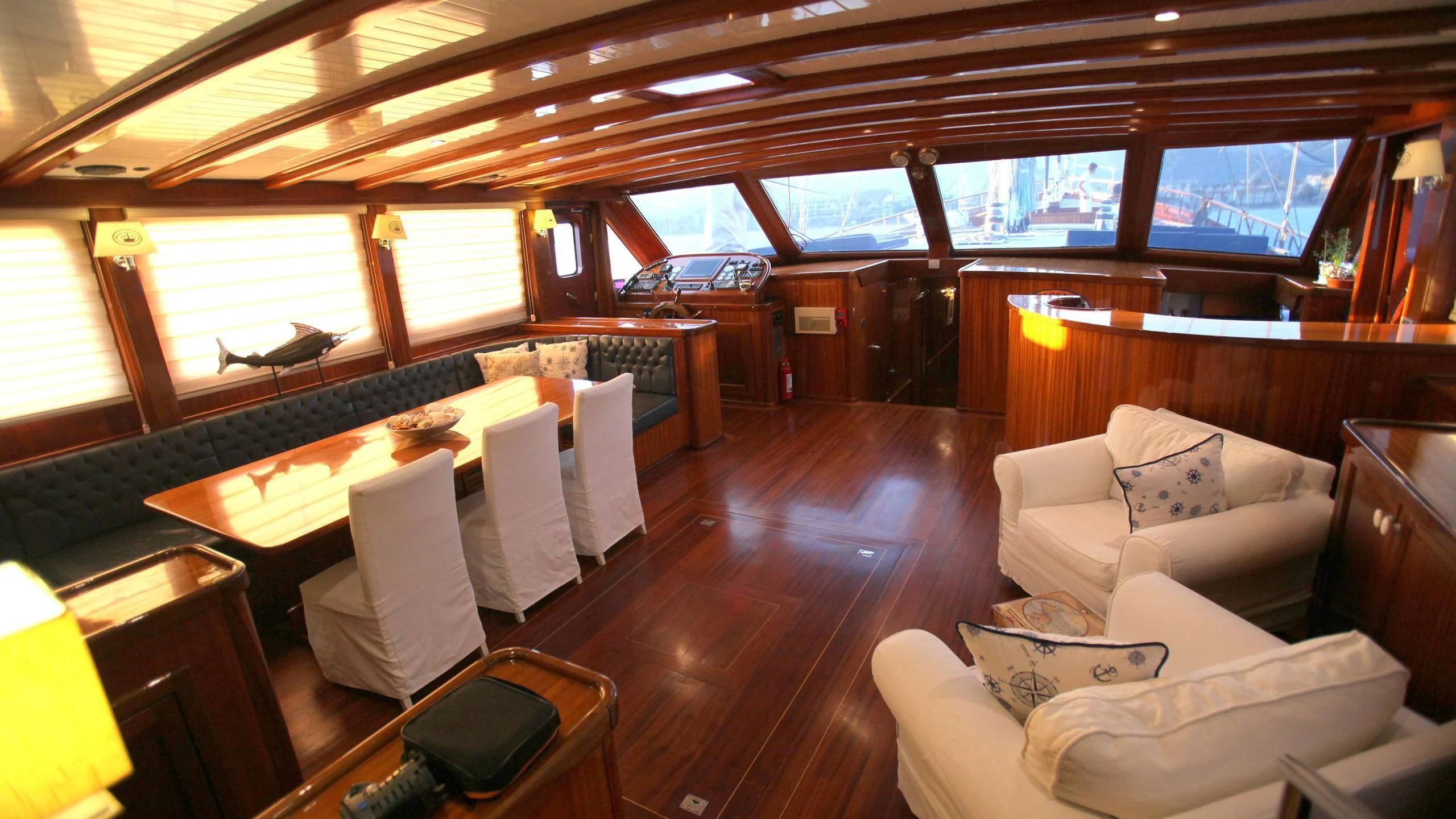 a room with a large bed and a couch aboard QUEEN OF DATCA Yacht for Charter