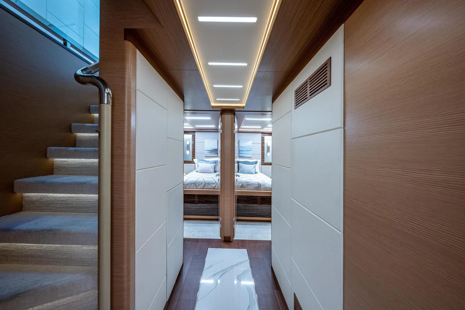a room with a bed and a door aboard SEASUITE Yacht for Charter