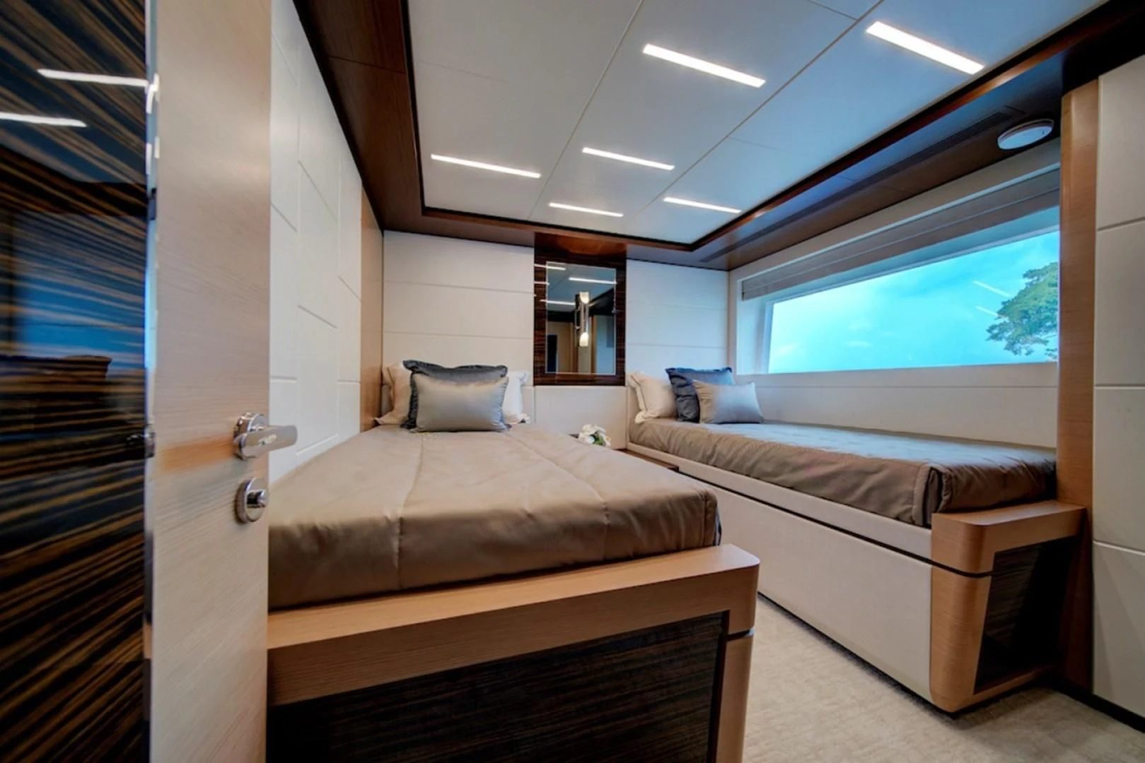 a room with a bed and a window aboard SEASUITE Yacht for Charter