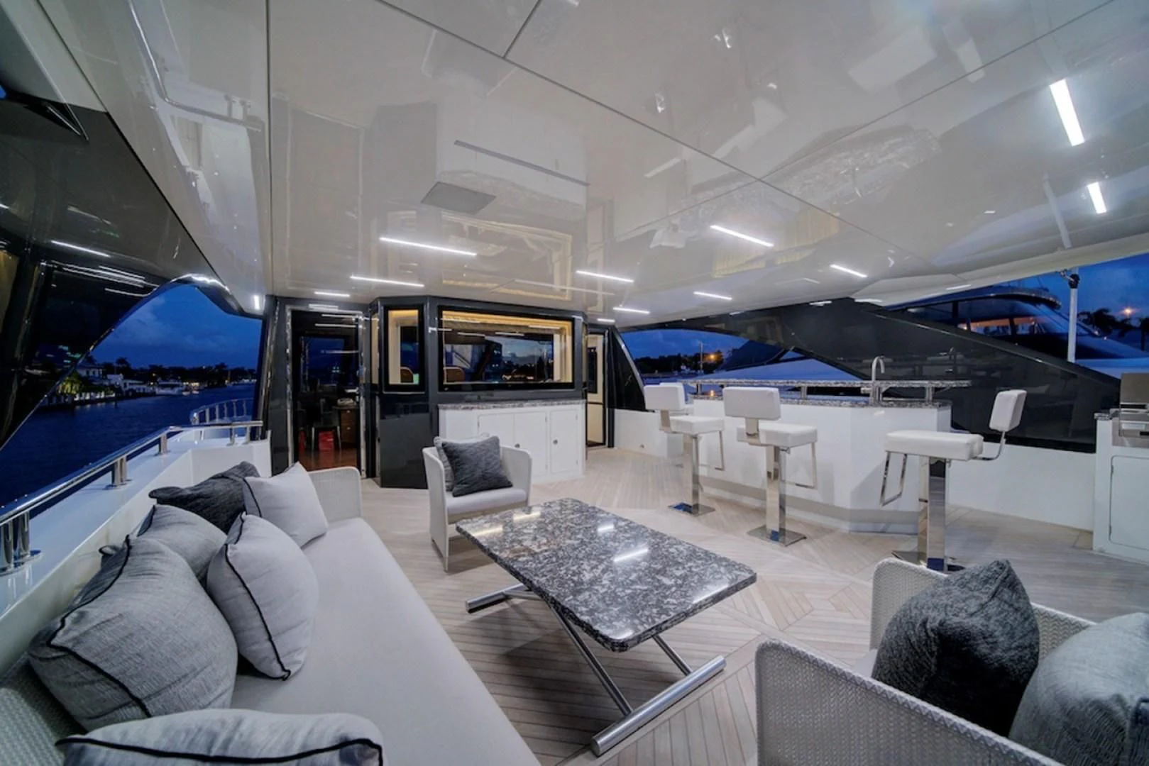 a room with a couch and a table and chairs aboard SEASUITE Yacht for Charter