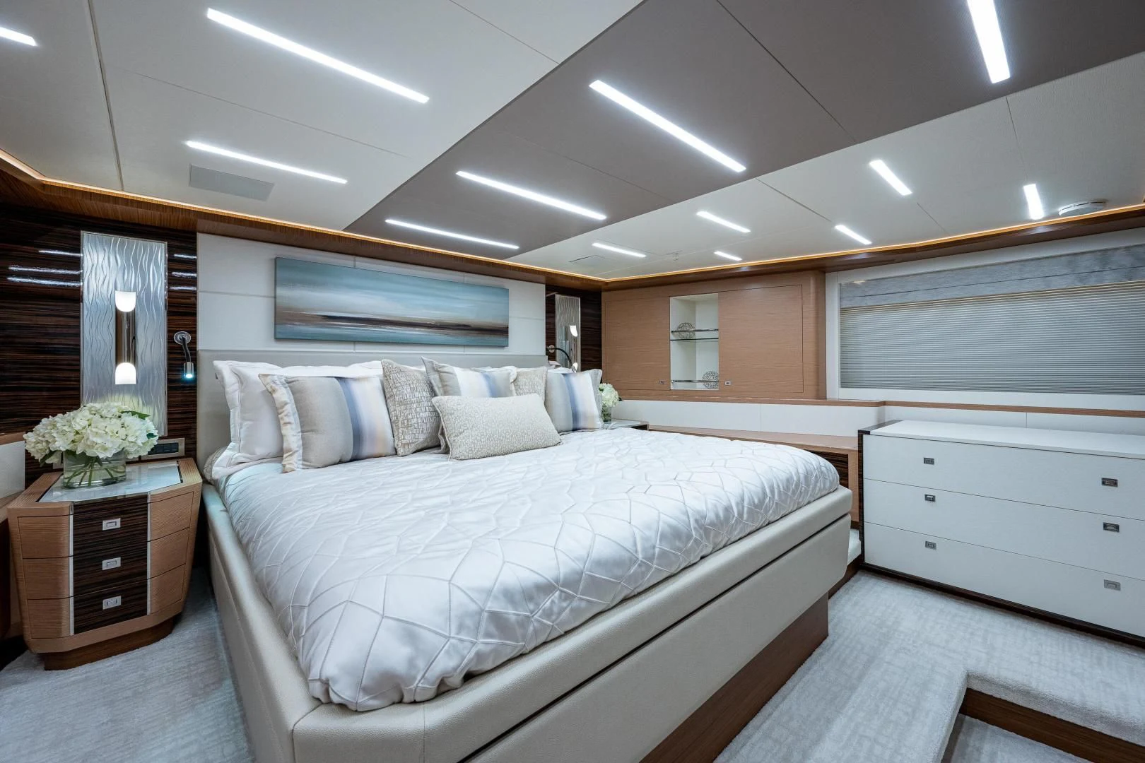 a large bedroom with a large bed aboard SEASUITE Yacht for Charter