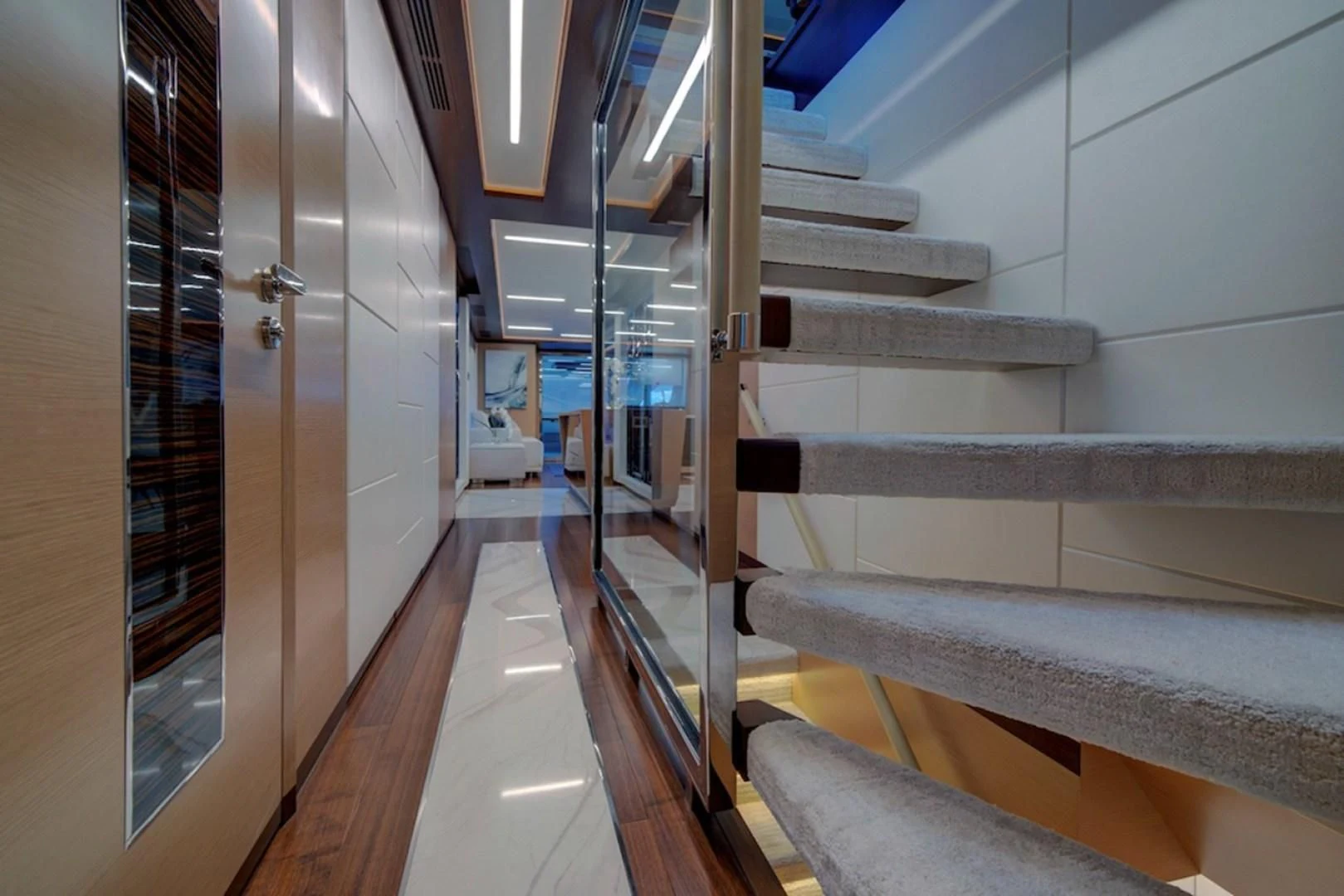 a hallway with glass doors aboard SEASUITE Yacht for Charter
