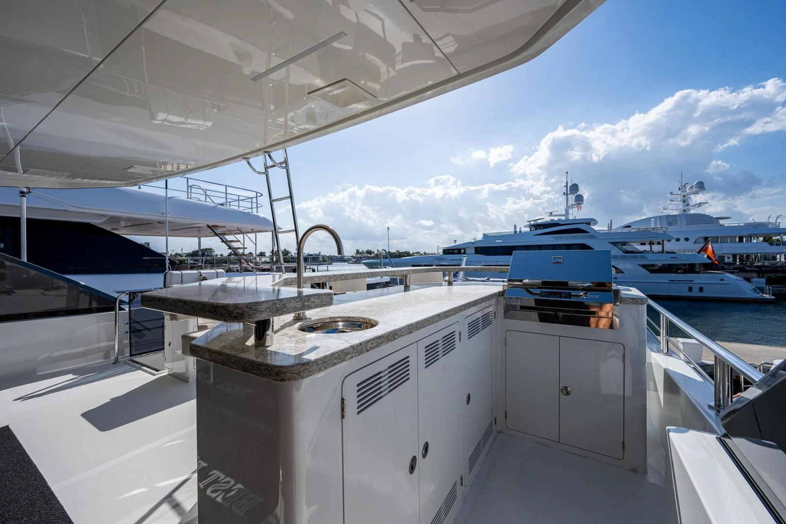 a large white boat in a large body of water aboard SEASUITE Yacht for Charter