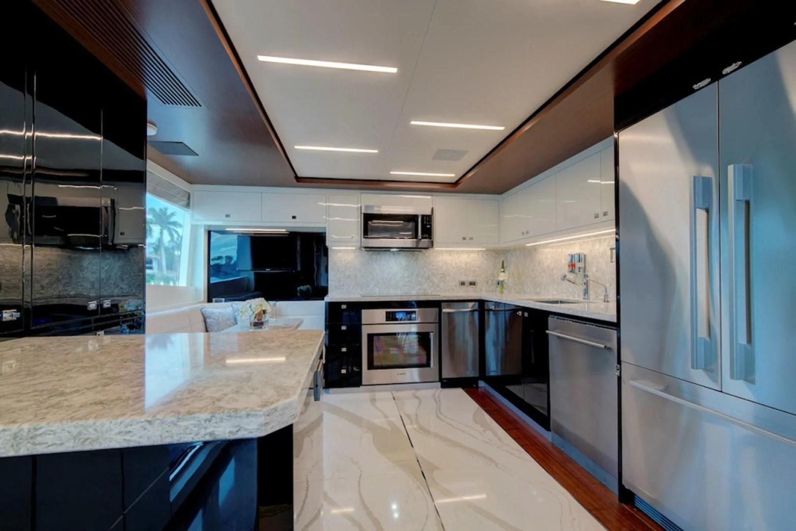 a kitchen with a large island aboard SEASUITE Yacht for Charter