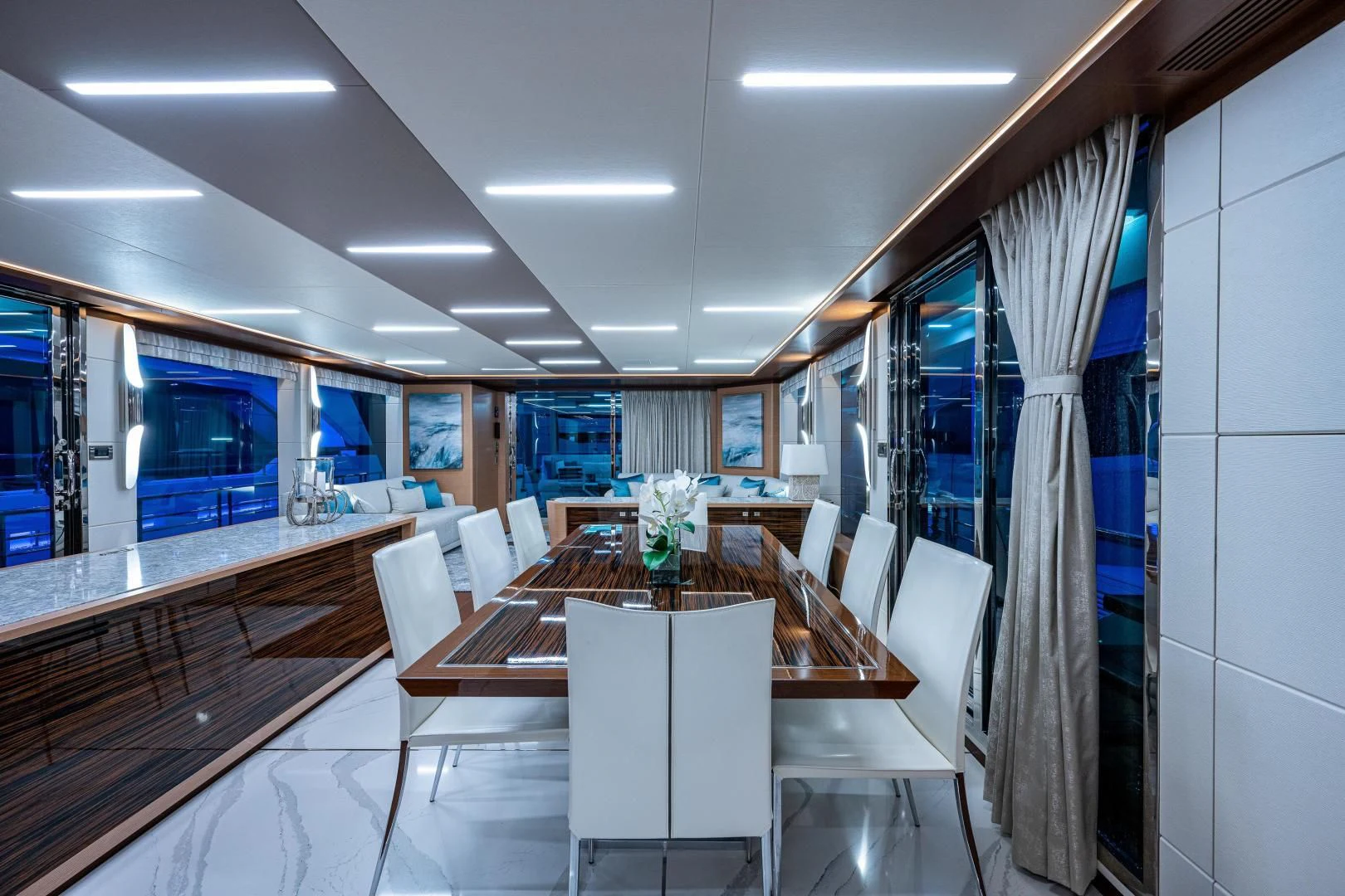 a room with a table and chairs aboard SEASUITE Yacht for Charter