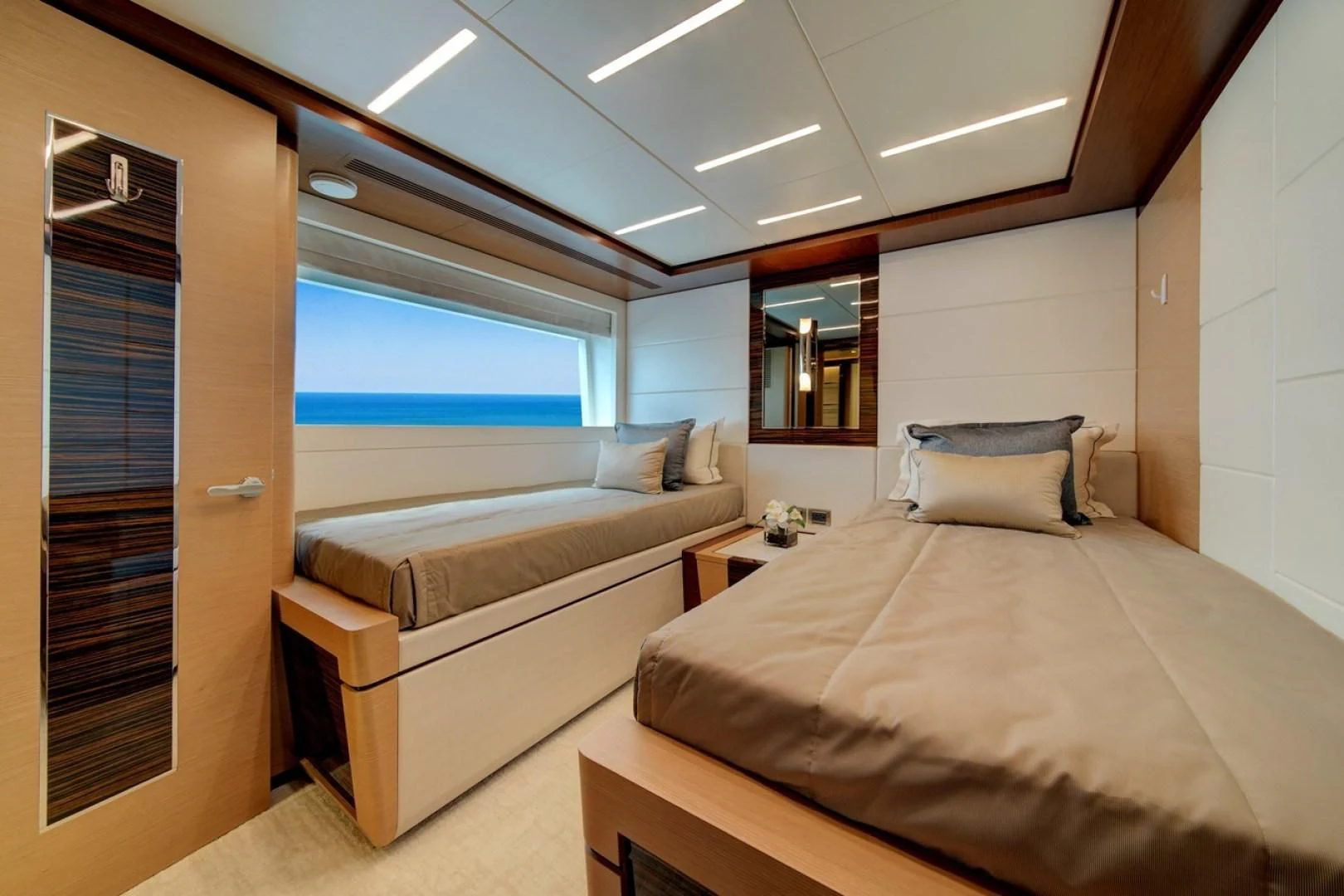 a room with a bed and a window aboard SEASUITE Yacht for Charter