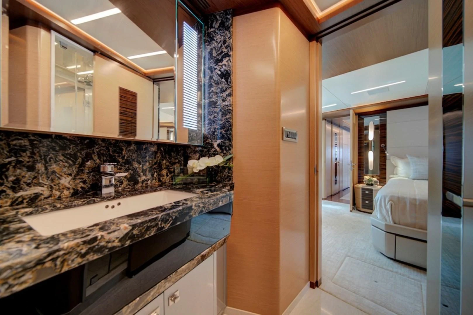 a bathroom with a large marble countertop aboard SEASUITE Yacht for Charter