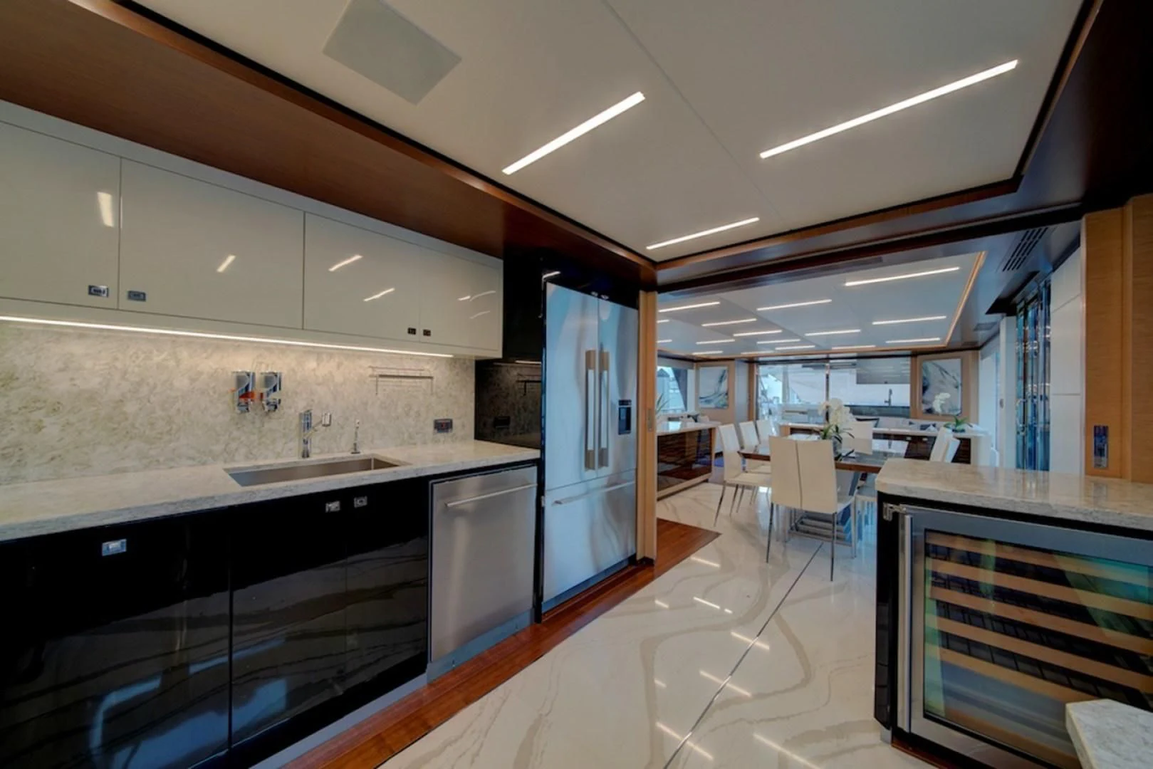 a kitchen with a large island aboard SEASUITE Yacht for Charter