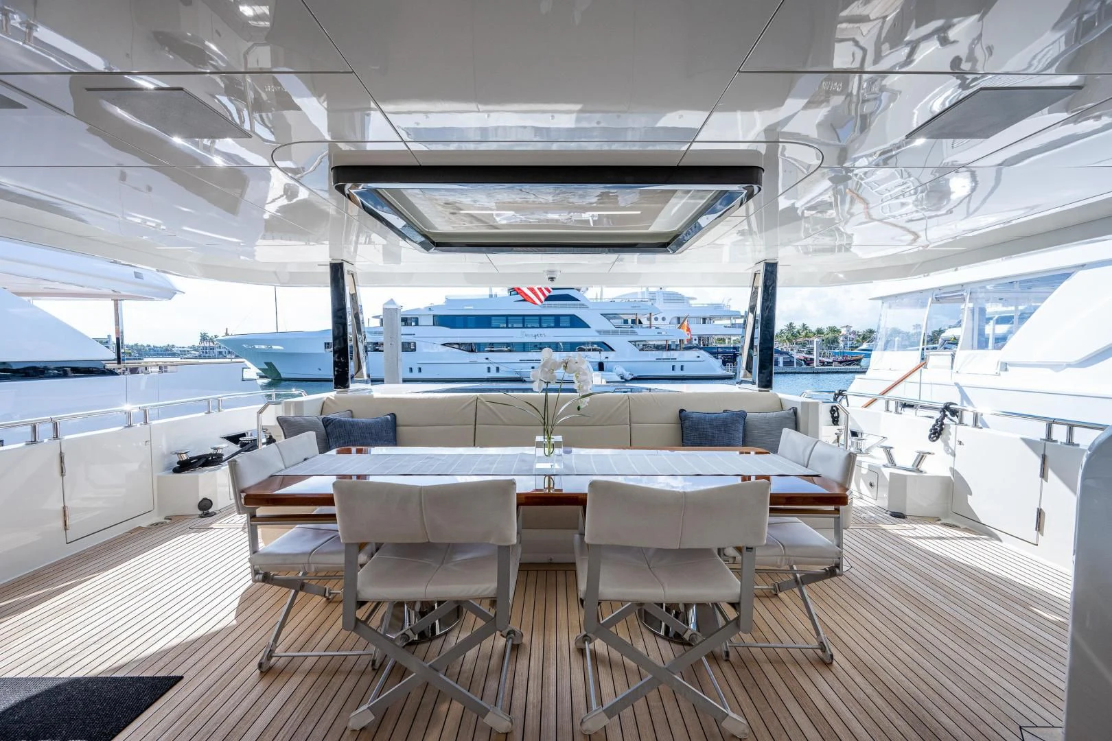 a room with a table and chairs aboard SEASUITE Yacht for Charter
