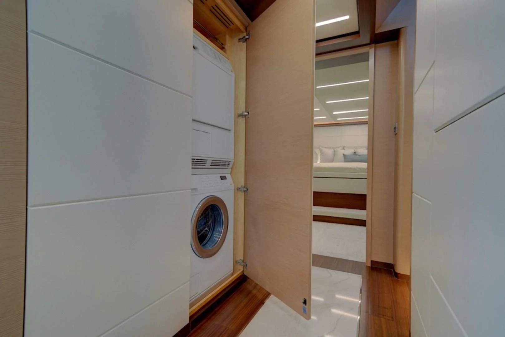 a room with a washing machine aboard SEASUITE Yacht for Charter
