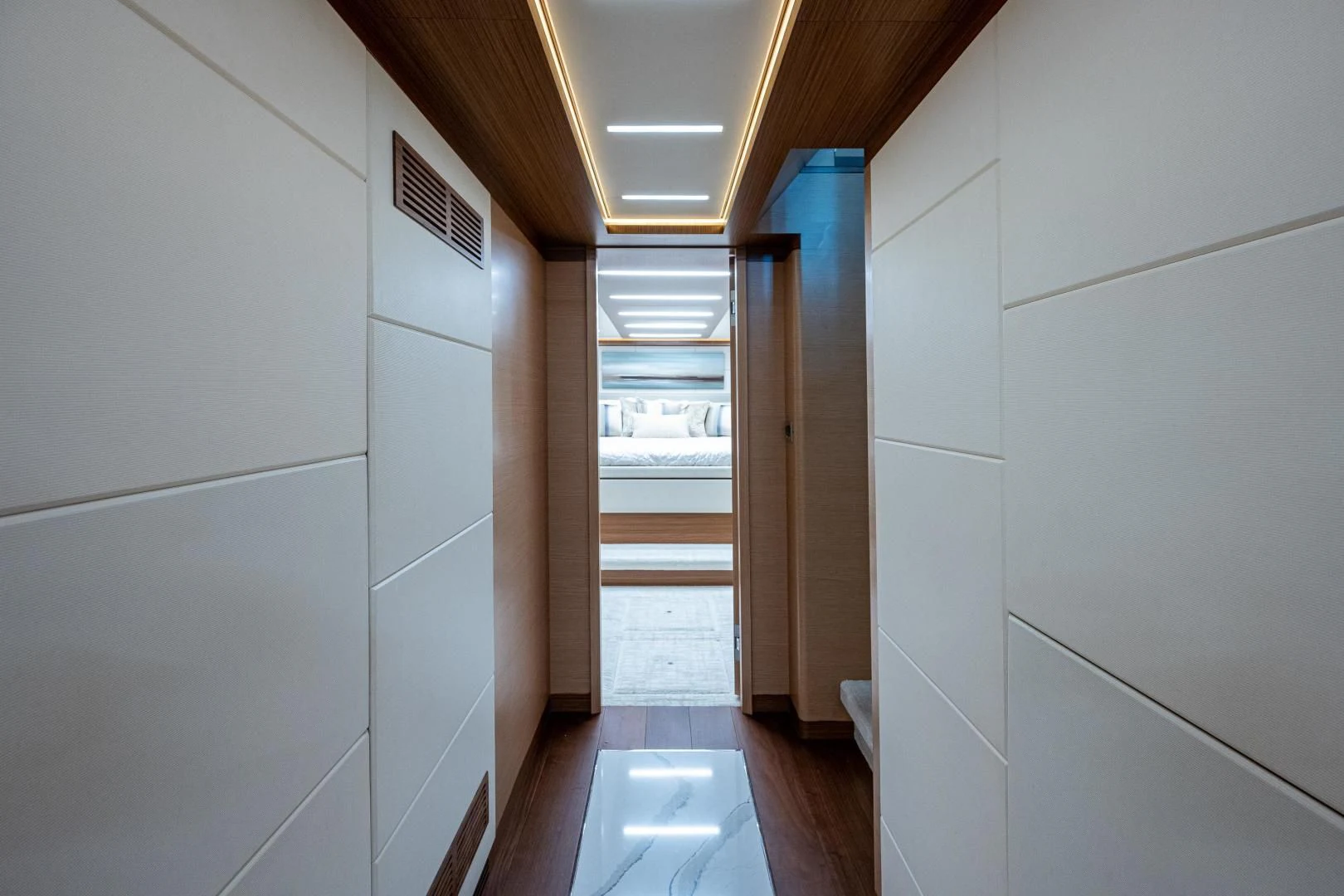 a hallway with white walls aboard SEASUITE Yacht for Charter
