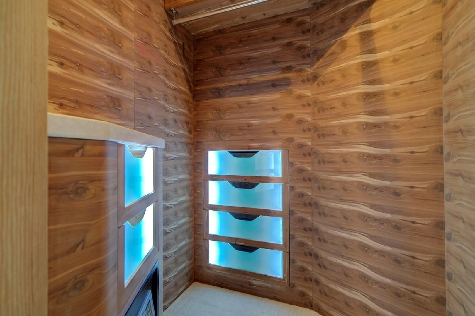 a wooden cabin with a window aboard SEASUITE Yacht for Charter