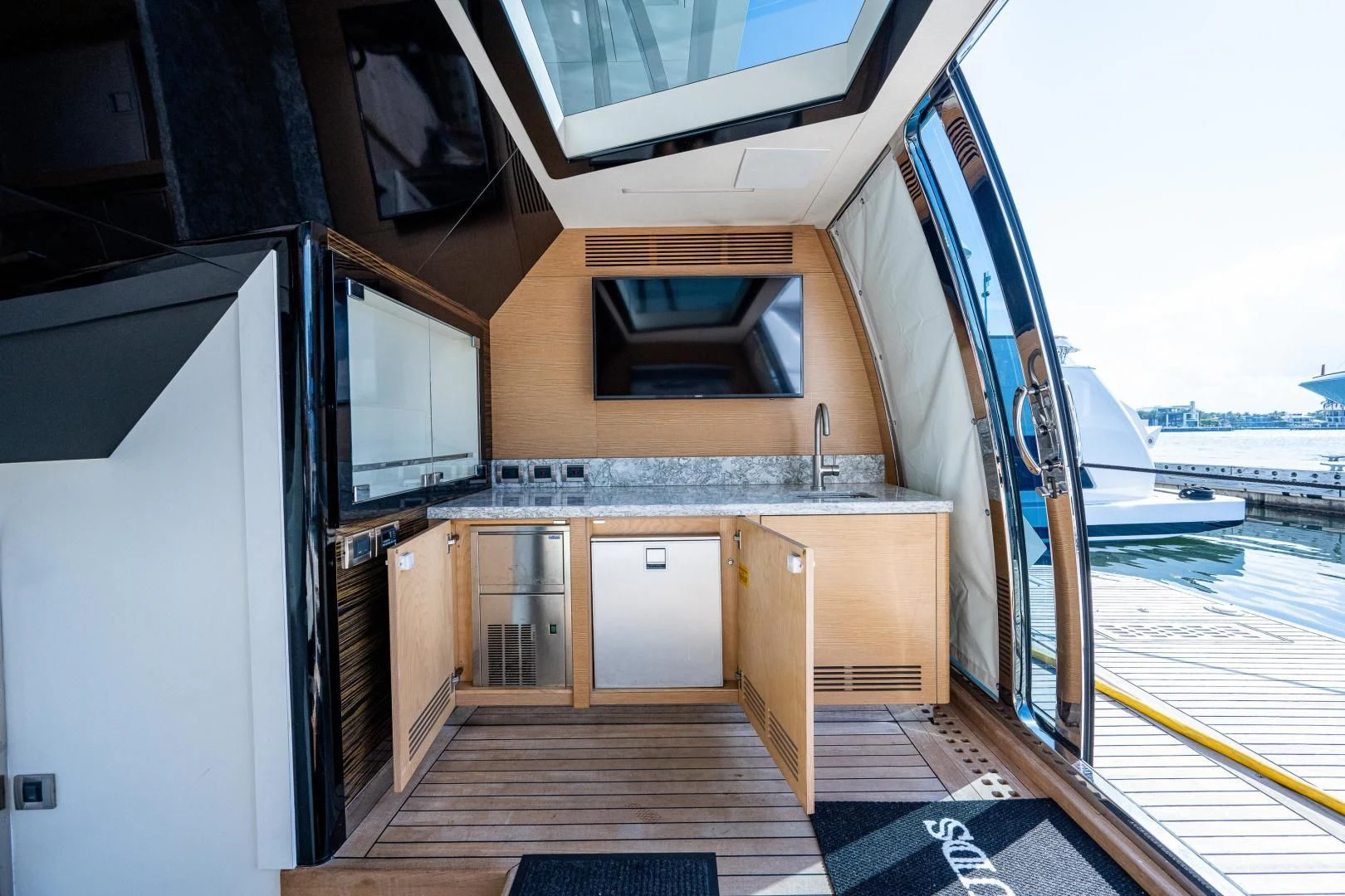 a wooden house with a large deck aboard SEASUITE Yacht for Charter