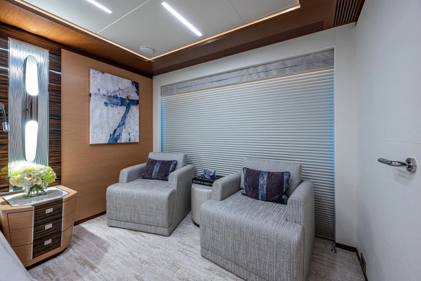a room with a couch and a chair aboard SEASUITE Yacht for Charter