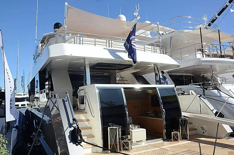 a boat docked at a pier aboard SEASUITE Yacht for Charter