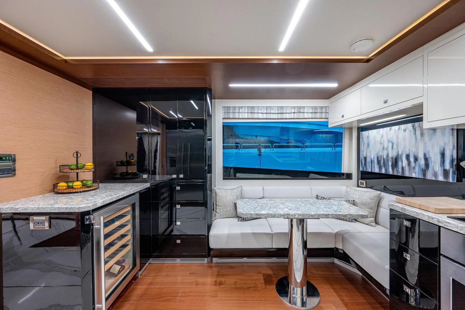 a kitchen with a large screen aboard SEASUITE Yacht for Charter