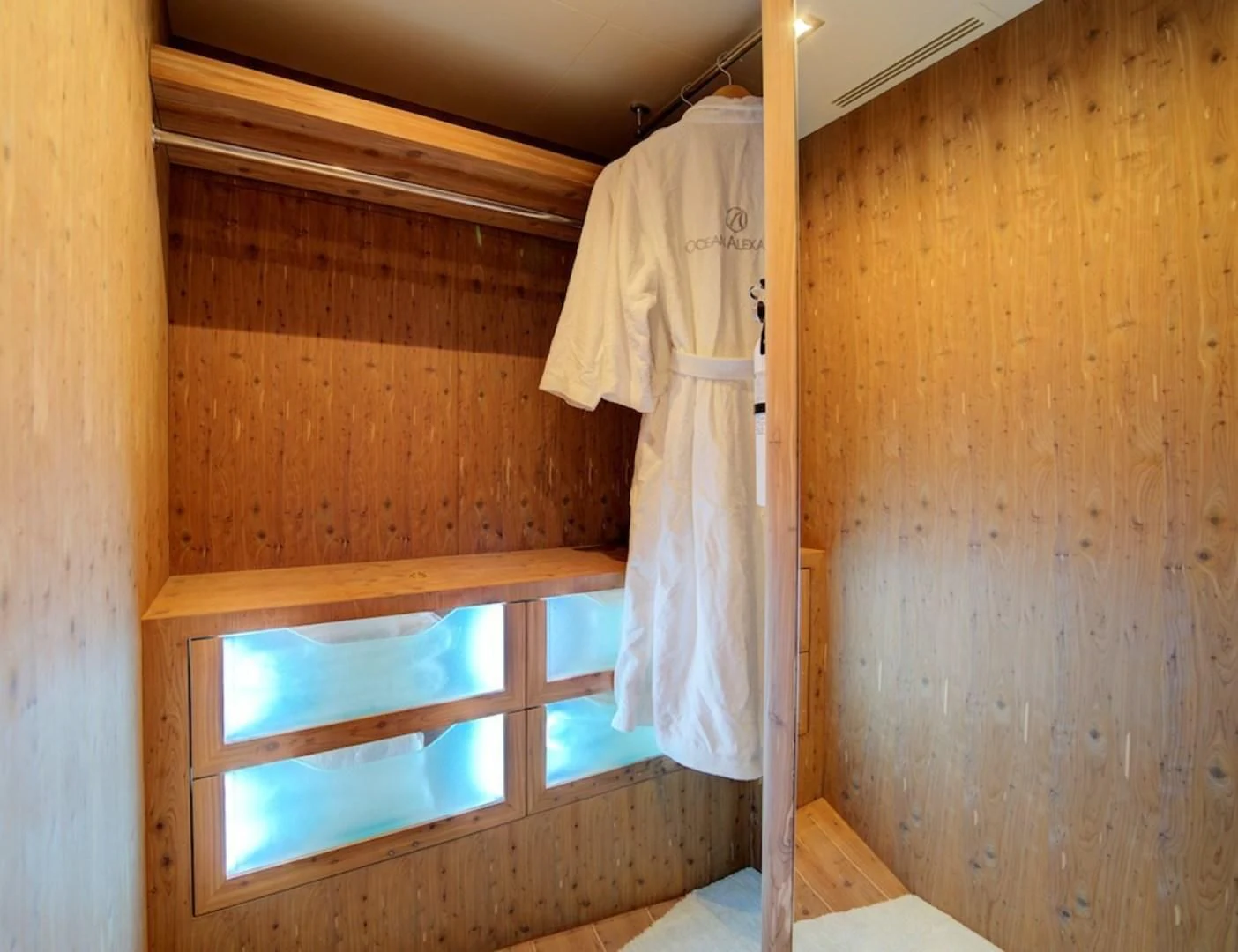 a room with a curtain and a window aboard SEASUITE Yacht for Charter