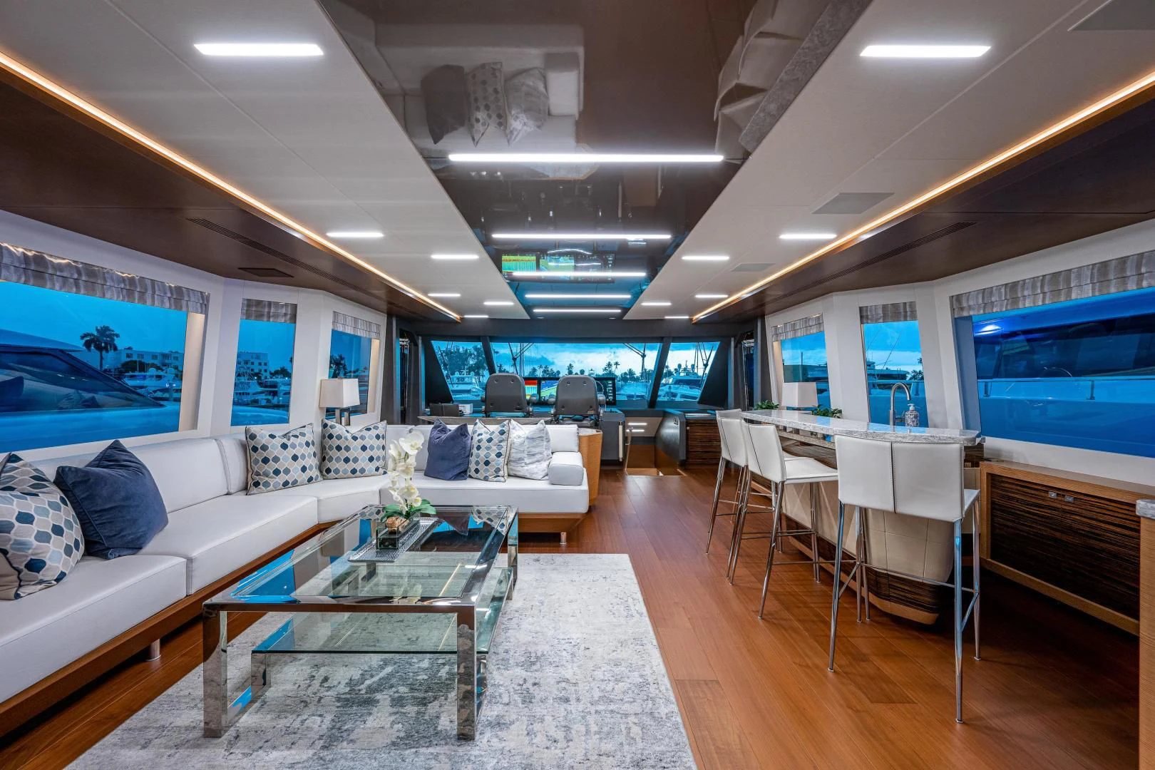 a living room with a large screen aboard SEASUITE Yacht for Charter