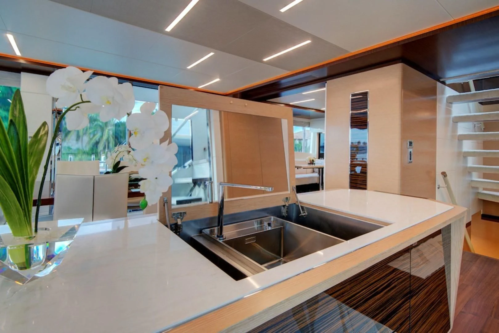 a kitchen with a large island aboard SEASUITE Yacht for Charter