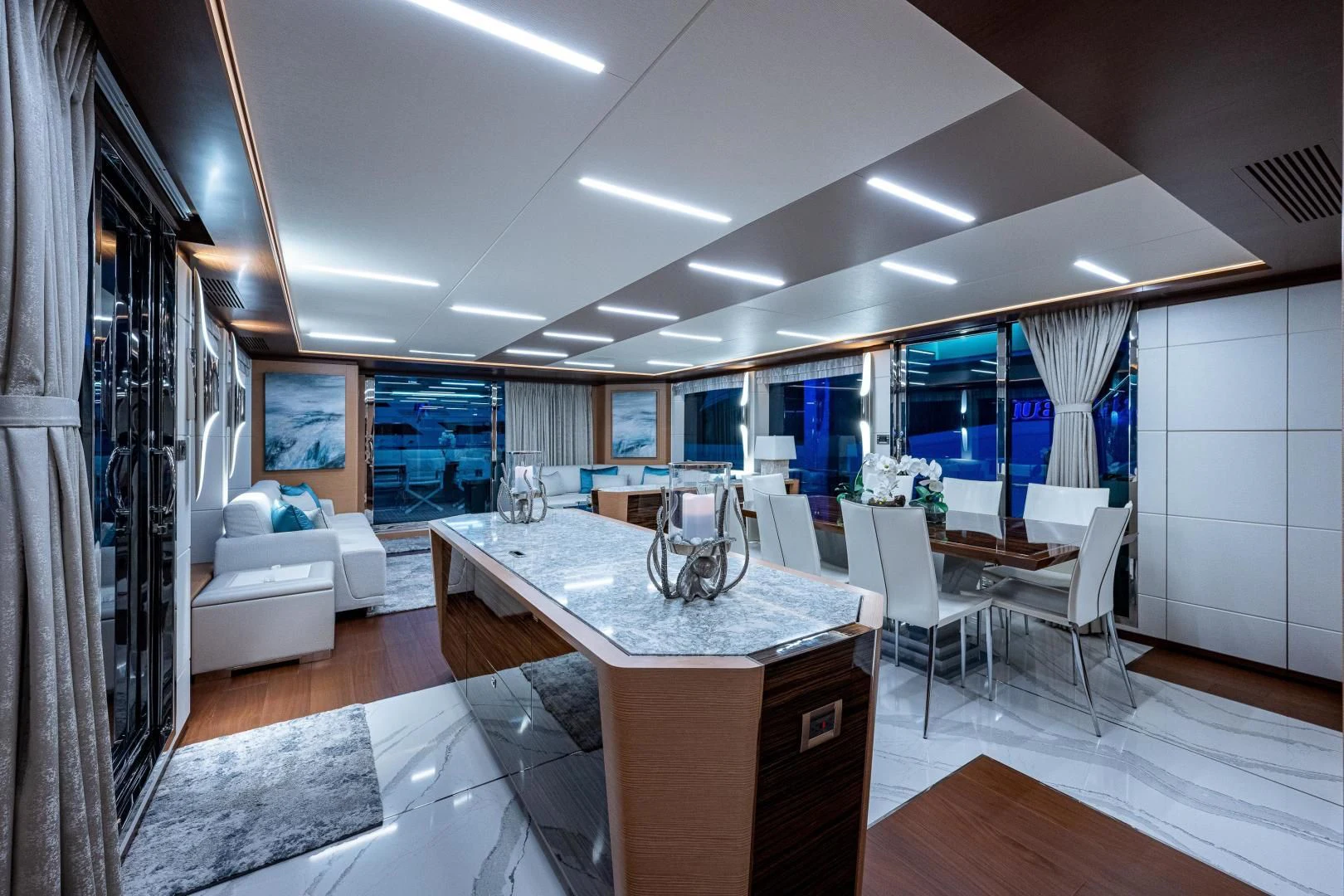 a large kitchen with a table aboard SEASUITE Yacht for Charter