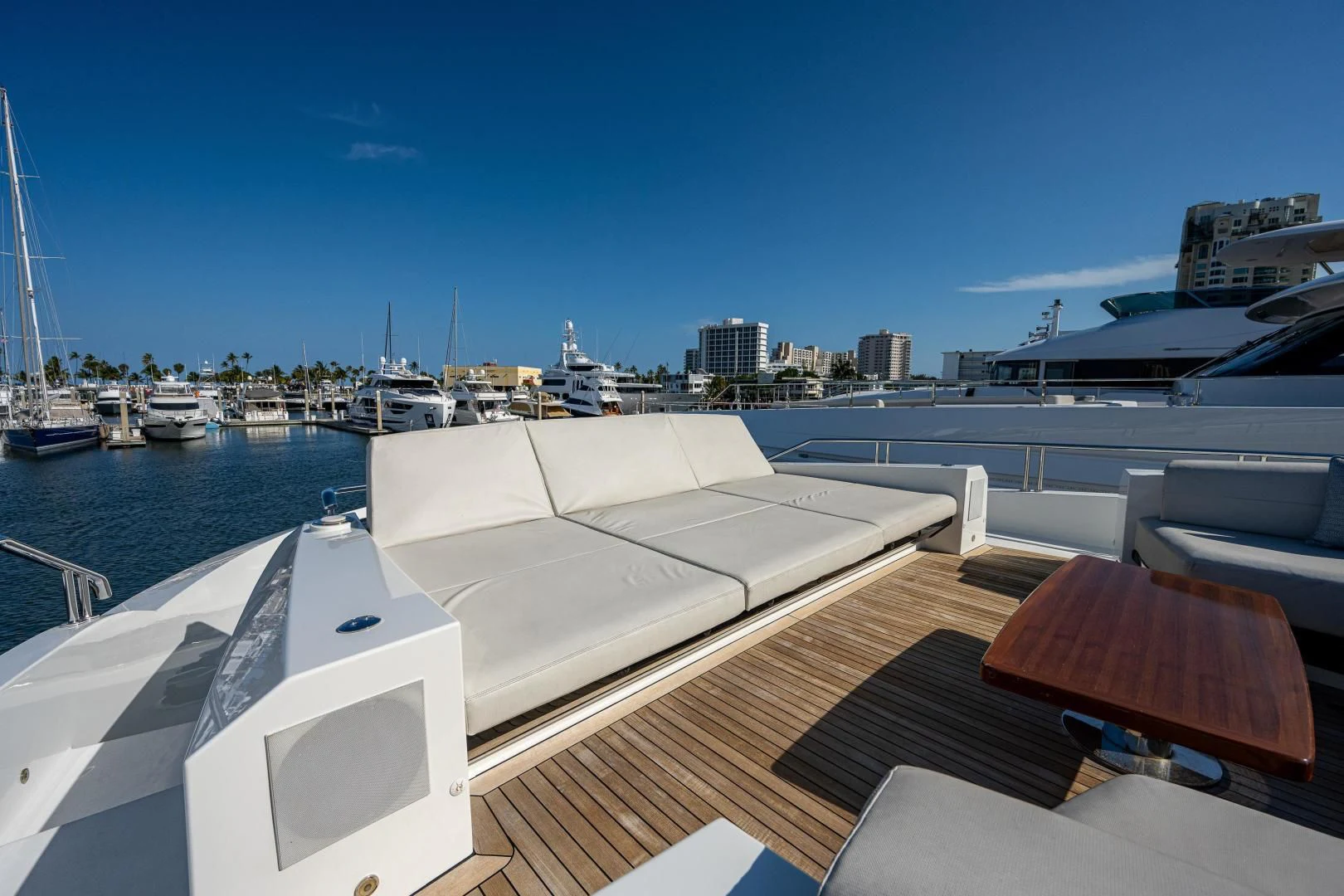 a deck with a view of a city and water aboard SEASUITE Yacht for Charter