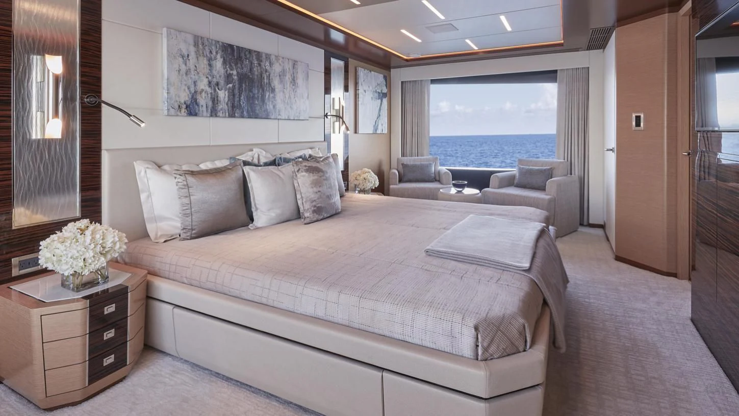 a large bed in a room aboard SEASUITE Yacht for Charter