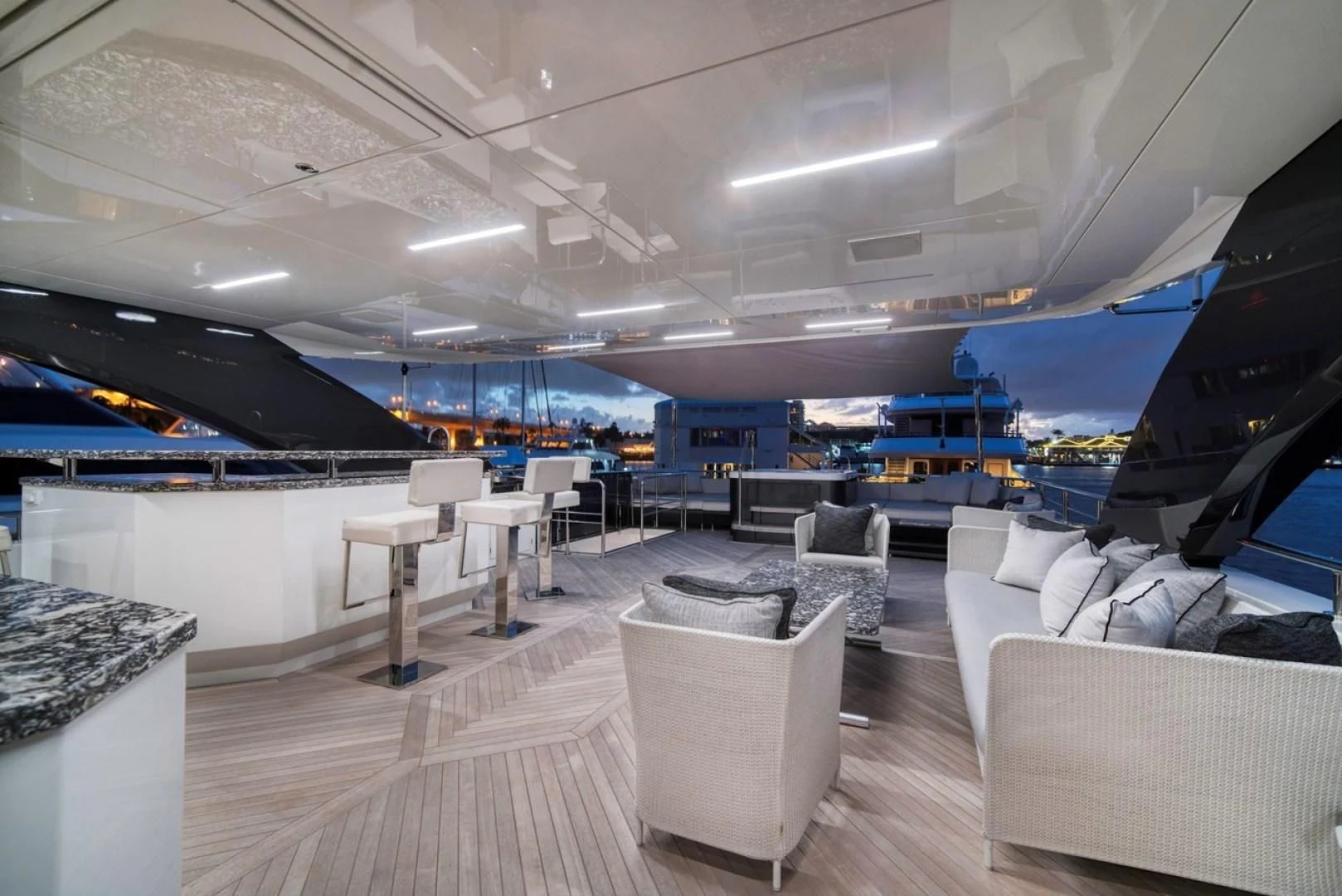 a room with a large table and chairs aboard SEASUITE Yacht for Charter