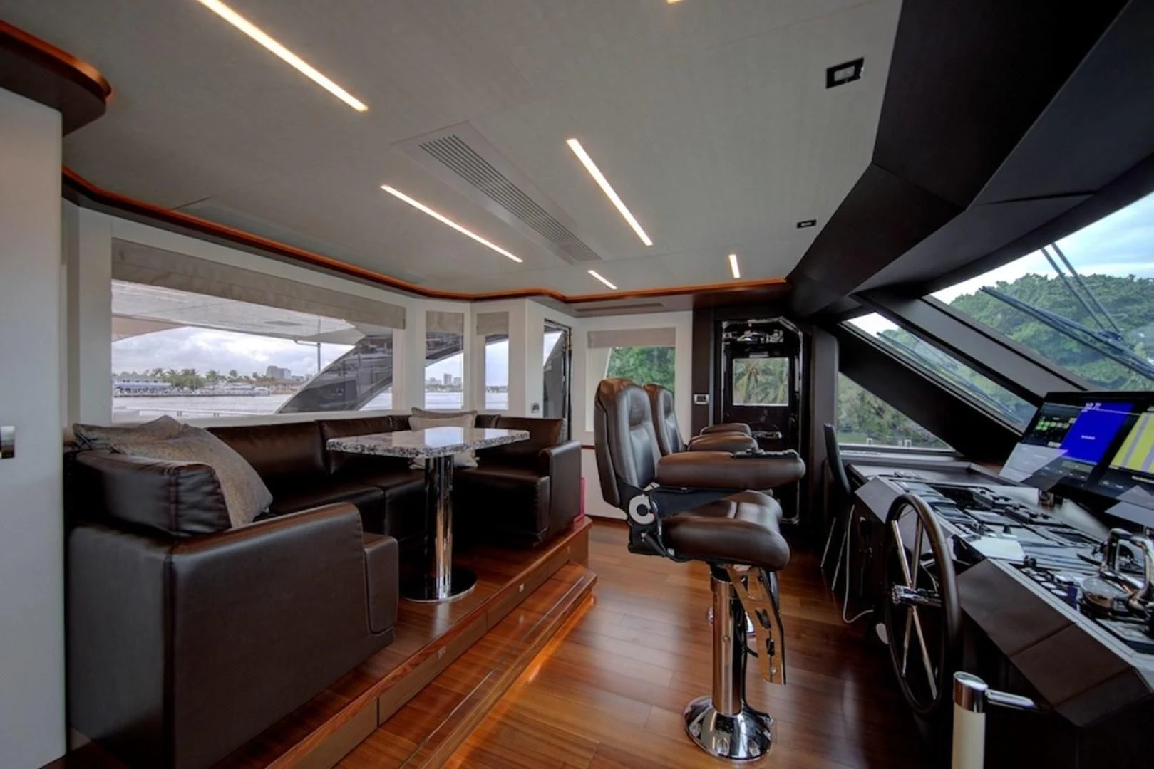 a room with a table and chairs aboard SEASUITE Yacht for Charter