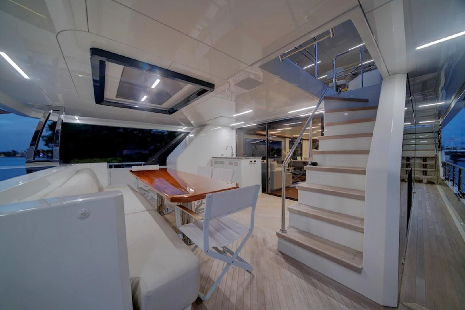a white staircase in a building aboard SEASUITE Yacht for Charter