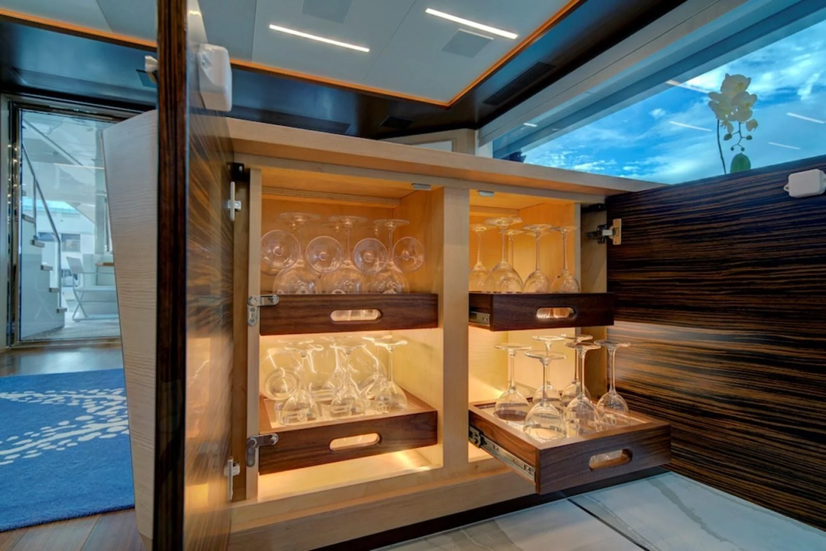 a glass case with glass objects aboard SEASUITE Yacht for Charter