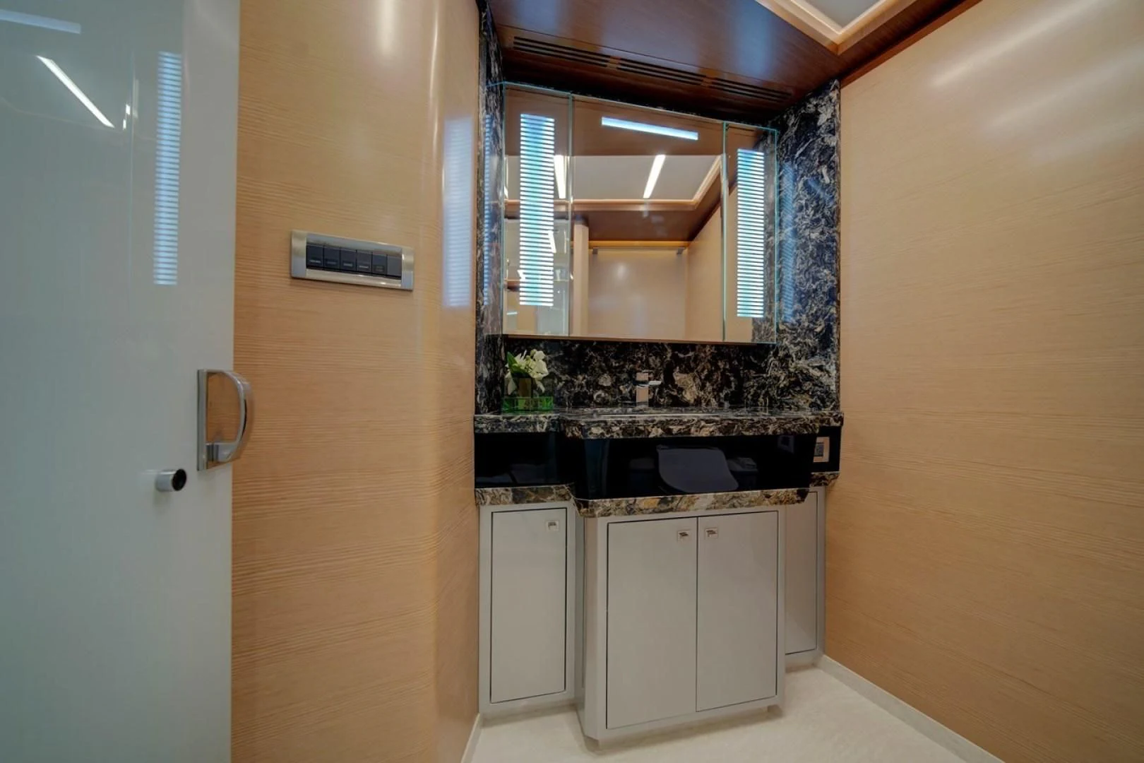 a kitchen with a large mirror aboard SEASUITE Yacht for Charter