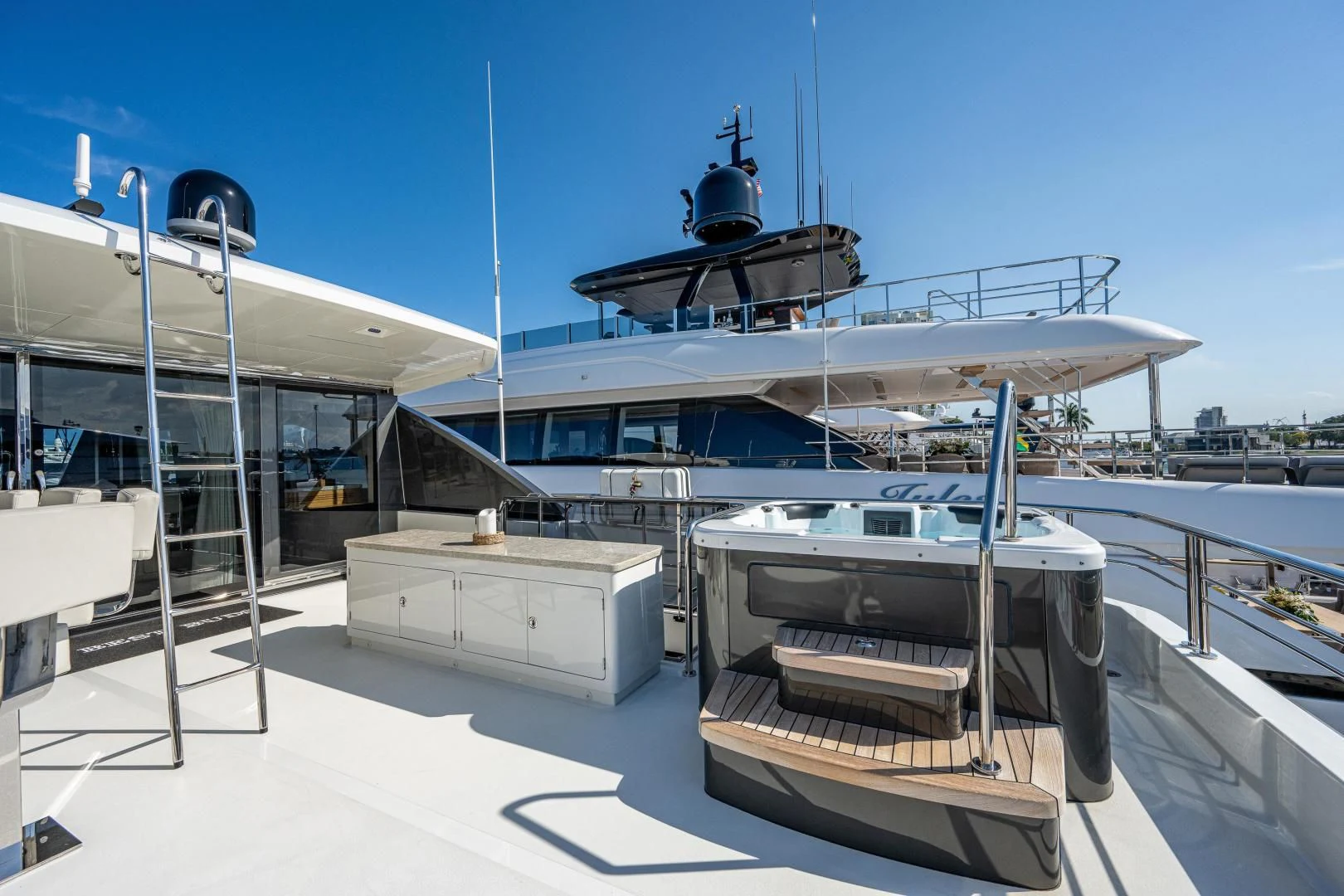 a large white boat on a dock aboard SEASUITE Yacht for Charter