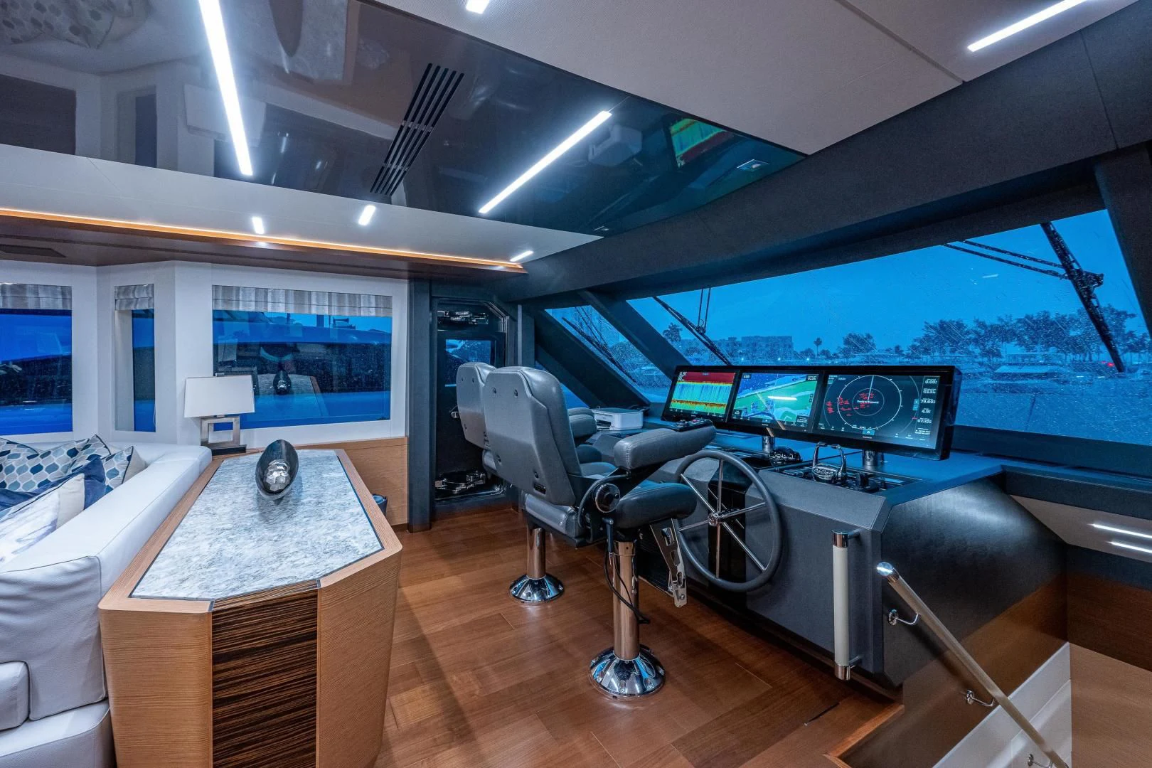 a room with a table and chairs aboard SEASUITE Yacht for Charter